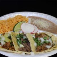 3 Tacos Plate · three tacos with onion and cilantro. meat of your choice with rice and beans and cotija cheese