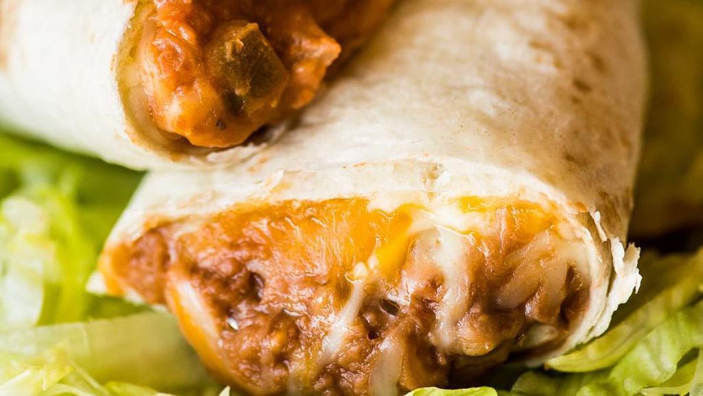 Bean And Cheese · Warm flour tortilla with refried beans and cheese.