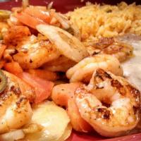 Camarones Tapatios · Jumbo shrimp grilled with jalapenos, onions, and tomatoes. Served with rice, beans, and flou...