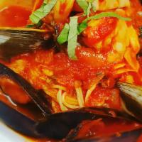 Frutti Di Mare · Capellini tossed with shrimp, mussels, scallops, littlenecks, calamari, spicy marinara.