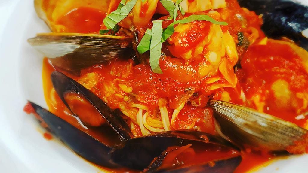 Frutti Di Mare · Capellini tossed with shrimp, mussels, scallops, littlenecks, calamari, spicy marinara.