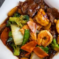 Triple Delight · Chicken beef shrimp with broccoli cabbage carrots mushrooms snow peas in spicy brown sauce. ...