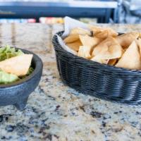 Chips And Guacamole · Fresh guacamole made with lime, chopped onions and cilantro. Served with our fresh homemade ...