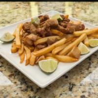 Chicharron · Fried pork belly served with fries.