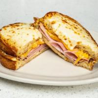 Ham & Cheese Sandwich · Black forest ham, cheddar, provolone, pepper jack on Asiago bread. Served with a side of Ket...