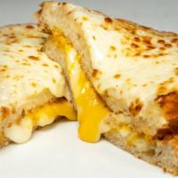 Grilled Cheese Sandwich · Cheddar, provolone, pepper jack on Asiago bread. Served with a side of Kettle chips