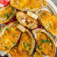 Roasted Oysters · Five True Chesapeake Skinny Dipper oysters topped with cheese, butter, and old bay the roast...