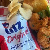 Fried Shrimp Sandwich · Jumbo gulf shrimp crispy fried with lettuce and tomato on a potato roll. Served with UTZ chi...