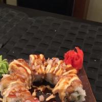 Fire Dragon Roll · Shrimp tempura & spicy tuna roll, topped with salmon, masago & 3 kind of sauces.