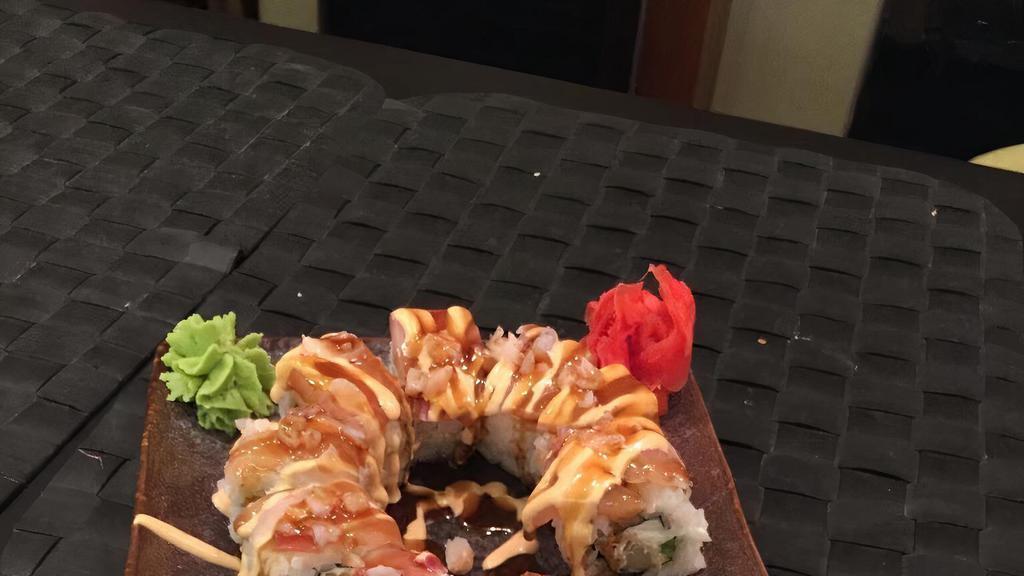 Fire Dragon Roll · Shrimp tempura & spicy tuna roll, topped with salmon, masago & 3 kind of sauces.