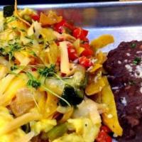 Chilaquiles Amigos! · Scrambled eggs and tortilla casserole with assorted cheeses, mixed peppers, onions, and gree...