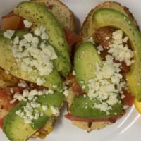 Hummus Toast · Your choice of toast smothered with hummus and layered with roasted corn, avocado, tomatoes ...