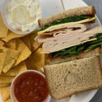 Thanksgiving Anytime · Roasted turkey breast, gouda cheese, fresh spinach, cranberry sauce and honey mustard on a w...