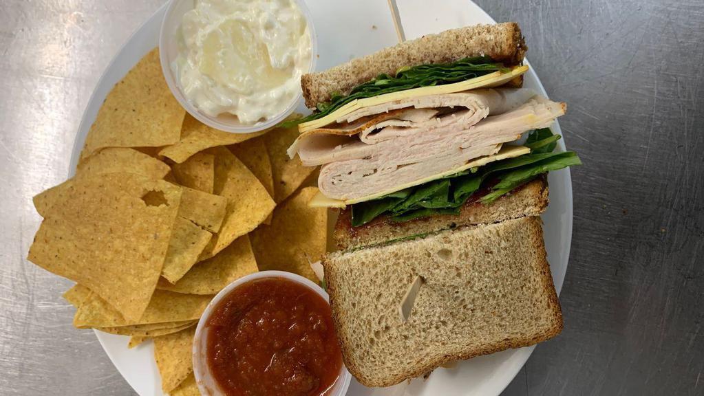 Thanksgiving Anytime · Roasted turkey breast, gouda cheese, fresh spinach, cranberry sauce and honey mustard on a whole wheat bread.