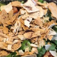 Fattoush · Traditional Mediterranean salad tossed with toasted pita chips & our homemade olive oil & he...
