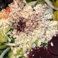 Greek Salad · House salad tossed with olives, beets, peppercini, feta cheese & our homemade olive oil & he...