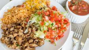 Fajitas Plate · Beef or chicken mixed with veggies served with and beans and your choice of corn or flour to...