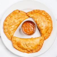 Empanadas · 3 fried pastries stuffed with seasoned ground beef and cheese. Served with rojo salsa.