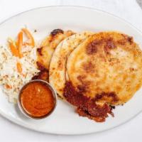 Pupusas · 3 grilled masa tortillas filled with cheese. Served with red sauce and pickled cabbage.