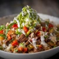Ultimate Steak Fries · An over flowing bowl of potatoes, steak,  pinto beans, pico, hot salsa, jalapeno, sour cream...