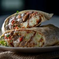 Zalapeno Burrito · Introducing a burrito stuffed with 3 zalapeno balls (shredded and fried potatoes mixed with ...