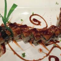Flying Dragon Maki · Crabmeat and avocado inside, whole eel on the top and eel sauce.