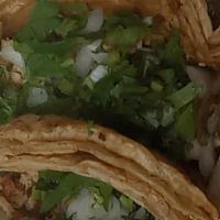 Taco Dinner · Two tacos with your choice of meat, onions, cilantro, served with rice and beans.