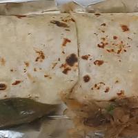 Burrito Dinner · Your choice of meat, lettuce, onions, tomatoes and sour cream, served with rice and beans on...