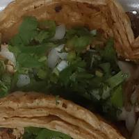 Tacos · Regular taco with onions & cilantro