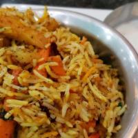 Vegetable Biryani  · Rice Cooked with Vegetable and Aromatic Spices