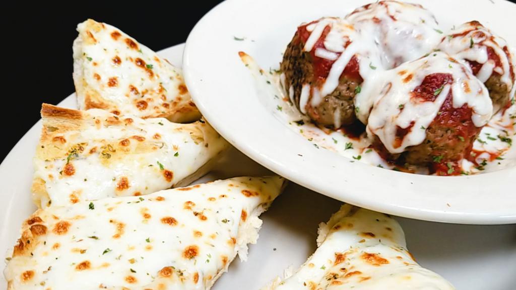 Meatballs & Cheese Bread · 4 of our amazing meatballs covered with sauce and baked mozzarella served with a 1/2 order of cheese bread.
