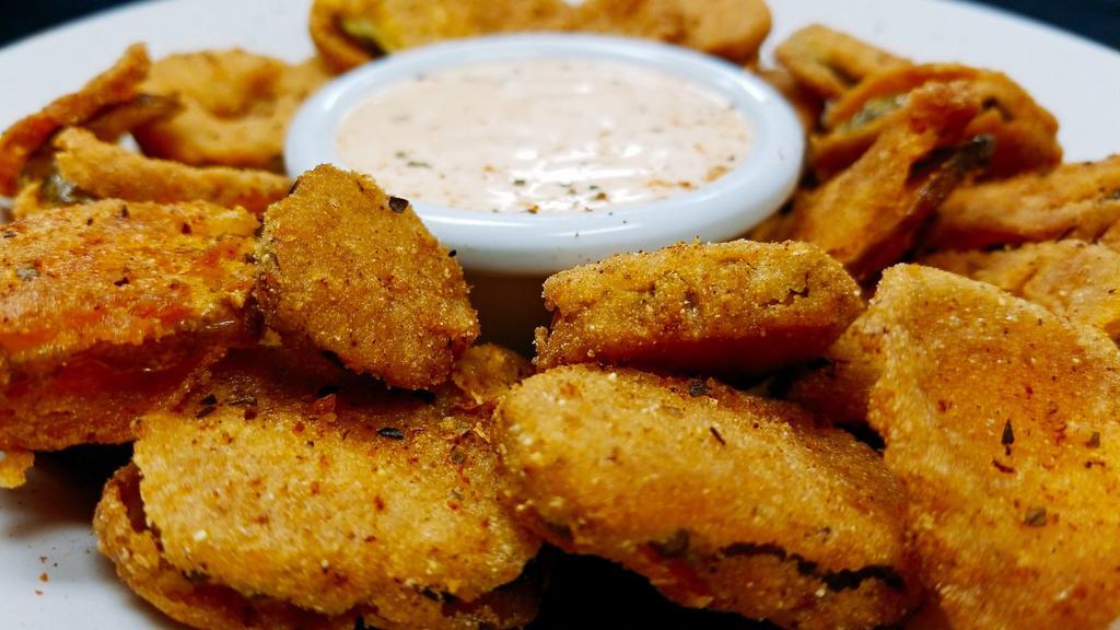 Fried Pickles · Lightly breaded pickle chips with a kick, fried and served with a side of chipotle ranch