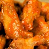 5 Traditional Wings · Jumbo crispy bone-in wings tossed in your choice of sauce: Parmesan Garlic, Sweet Chili, Buf...