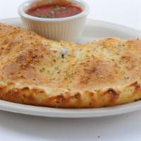 Individual Sausage & Pepper Calzone · Mozzarella, ricotta, Italian sausage,  red  and green bell peppers