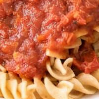 Kids Pasta · Corkscrew pasta served with a garlic roll and you choice of marinara or Alfredo sauce, add g...