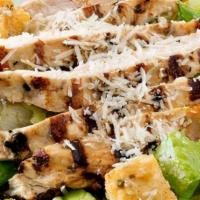 Chicken Caesar Salad · Crisp romaine lettuce tossed with Romano cheese, croutons and Caesar dressign topped with a ...