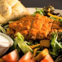 Buffalo Chicken Salad · Fresh iceberg & romaine lettuce with  tomatoes and red onion topped with croutons, cheddar a...