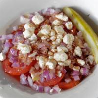 Tomato & Onion Salad · It's all in the name.  A bowl of tomato, onion,  feta cheese, and Italian dressing served wi...