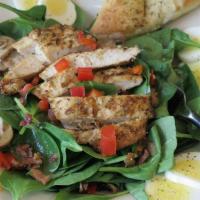 Spinach Salad · Baby spinach, mushrooms, egg s and red bell pepper drizzled with warm Italian dressing, baco...