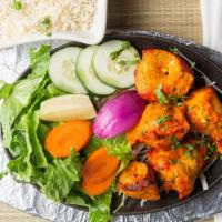Chicken Tikka · Chunks of boneless white chicken meat marinated with yogurt and freshly ground spices, grill...