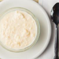 Nepali Kheer - Traditional Rice · Pudding long grain rice and almonds simmered in saffron and cardamom flavored milk.