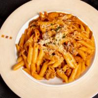 Chicken Brunello · Chicken fillet sauteed with mushrooms in a rose marsala wine sauce over penne pasta.