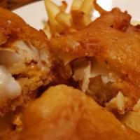Homemade Fish N Chips · Cod fillet, deep fried London style. Served with French fries,homemade cole slaw and tartar ...