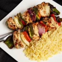 Chicken Kabob · Lightly marinated chicken, skewered and chargrilled with peppers and onions. Served with rice.