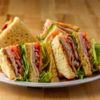 Rooster'S Club · Turkey, ham, and bacon with swiss cheese, lettuce, tomato, onion and Russians dressing on to...