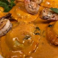 Seafood Delight · Lobster ravioli topped with grilled jumbo shrimp in vodka sauce.