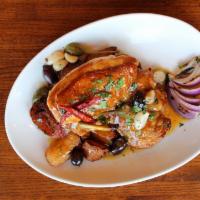 Campo Lindo Chicken  · Local chicken, crispy potatoes, roasted garlic, olives, chilies, caper berries (gf)