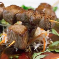 Beef Tori · 2 tender skewers marinated and broiled, topped with our homemade teriyaki sauce.