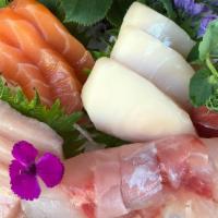 Sake Sashimi · Salmon. 4 pieces over daikon.