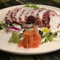 Tako Sashimi · Steamed octopus. 4 pieces over daikon.